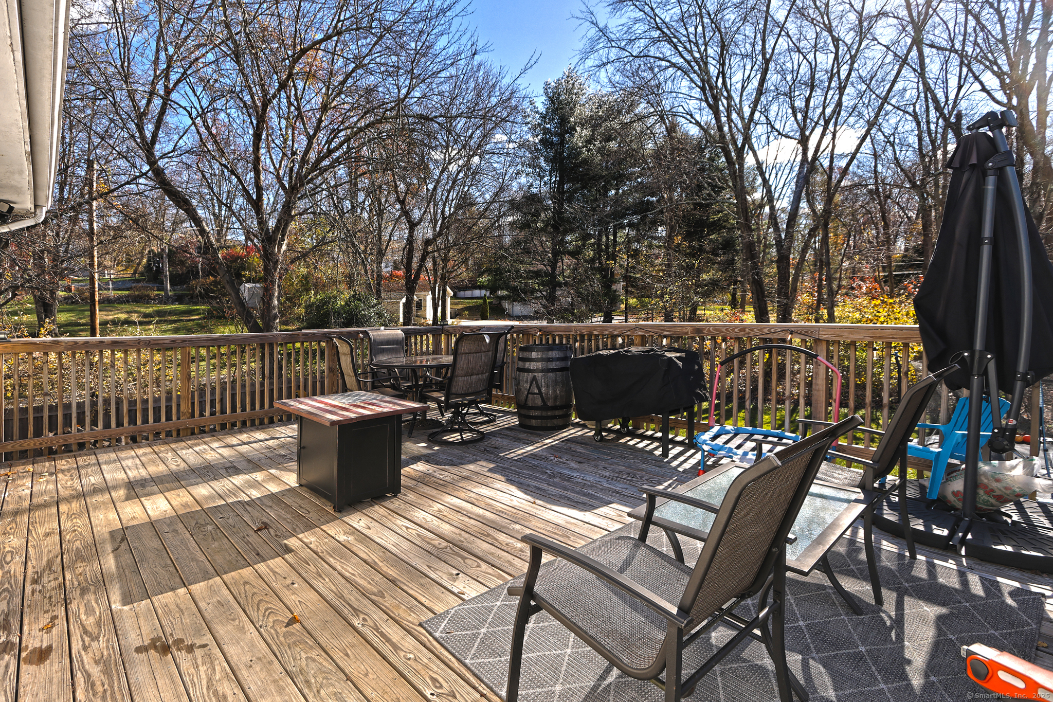 463 Mulberry Street Naugatuck, CT 06770 - Photo 17 of 21 a view of a patio with table and chairs and wooden floor