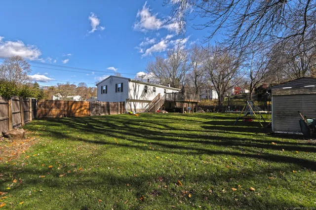 a view of a patio with table and chairs and wooden floor
