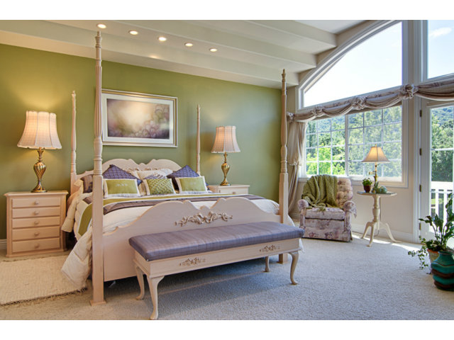 14065 Arnerich Road Los Gatos, CA 95032 - Photo 14 of 25 a bedroom with a bed and large windows