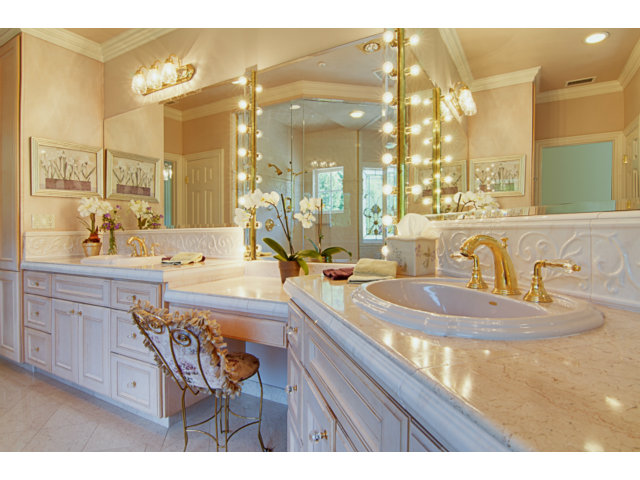14065 Arnerich Road Los Gatos, CA 95032 - Photo 17 of 25 a bathroom with a granite countertop sink a large mirror and a bathtub