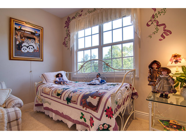 14065 Arnerich Road Los Gatos, CA 95032 - Photo 19 of 25 a bedroom with a bed and a window