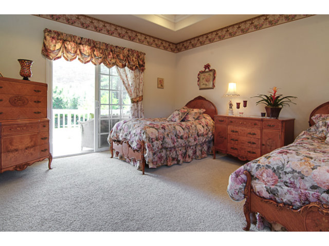 14065 Arnerich Road Los Gatos, CA 95032 - Photo 20 of 25 a spacious bedroom with two beds and a large window