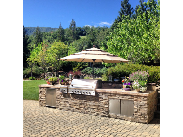 14065 Arnerich Road Los Gatos, CA 95032 - Photo 22 of 25 a view of a chairs and table under an umbrella in patio