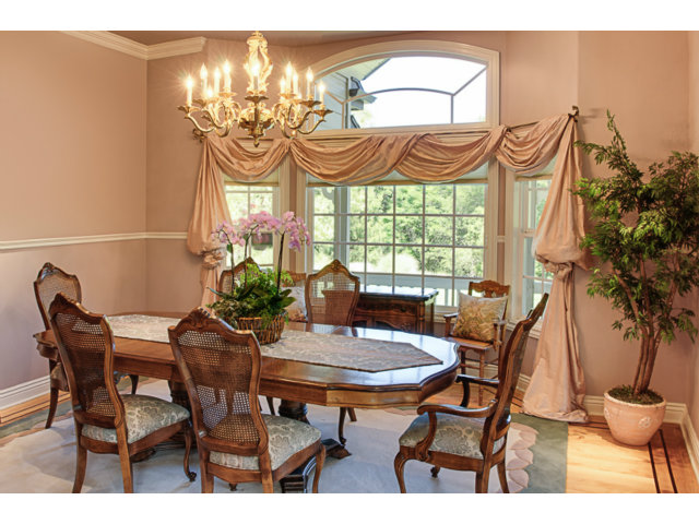 14065 Arnerich Road Los Gatos, CA 95032 - Photo 6 of 25 a view of a dining room with furniture and chandelier