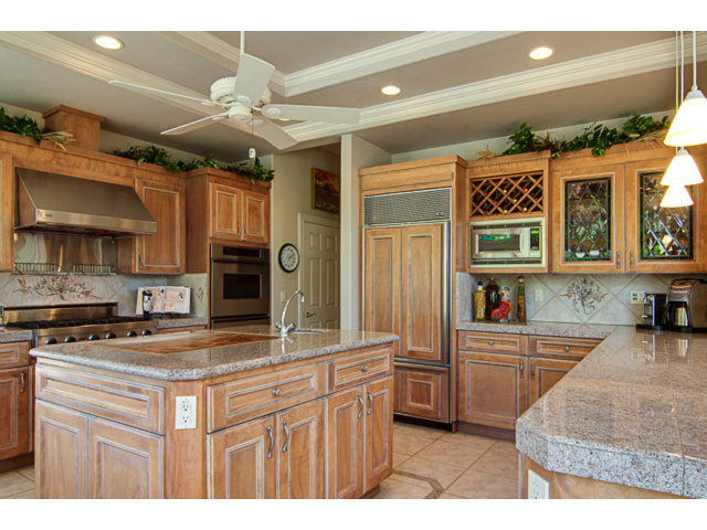 14065 Arnerich Road Los Gatos, CA 95032 - Photo 7 of 25 a kitchen with kitchen island granite countertop a sink cabinets and stainless steel appliances