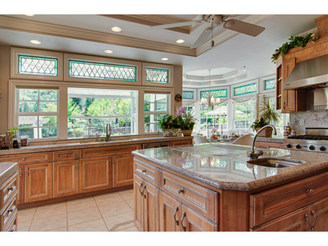 14065 Arnerich Road Los Gatos, CA 95032 - Photo 8 of 25 a kitchen with kitchen island granite countertop a sink and a counter top space