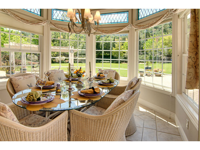 14065 Arnerich Road Los Gatos, CA 95032 - Photo 10 of 25 a dining room with furniture and large windows