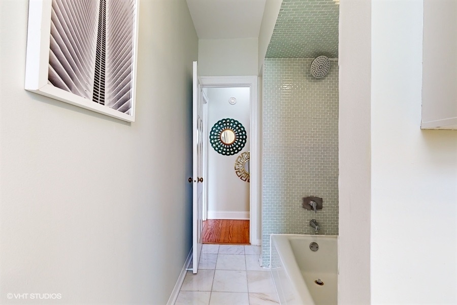 1316 Maple Avenue, Unit F1 Evanston, IL 60201 - Photo 7 of 13 a bathroom with a bathtub and shower