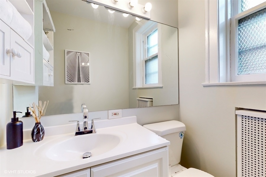 1316 Maple Avenue, Unit F1 Evanston, IL 60201 - Photo 8 of 13 a bathroom with a sink and a toilet
