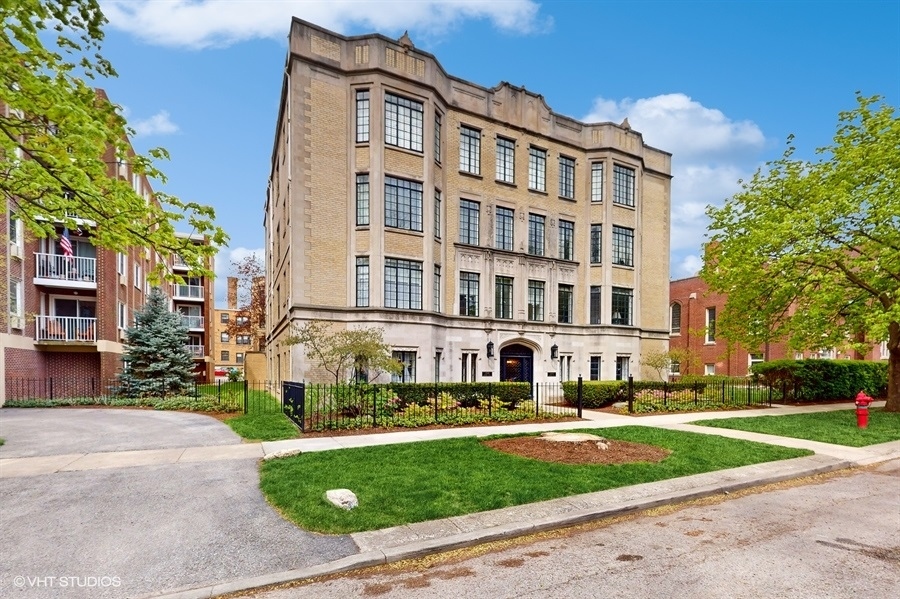 1316 Maple Avenue, Unit F1 Evanston, IL 60201 - Photo 2 of 13 a front view of a building with a yard