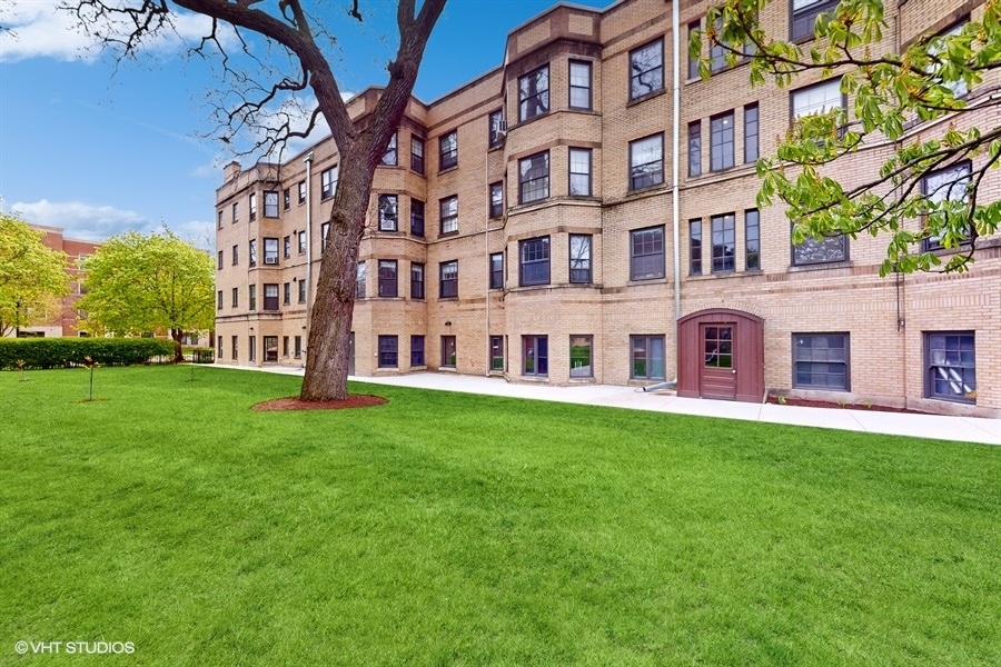 1316 Maple Avenue, Unit F1 Evanston, IL 60201 - Photo 12 of 13 a view of a building with a yard