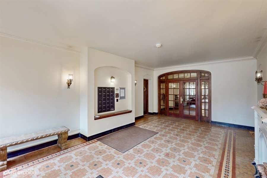 1316 Maple Avenue, Unit F1 Evanston, IL 60201 - Photo 3 of 13 a view of a livingroom with wooden floor and a fireplace