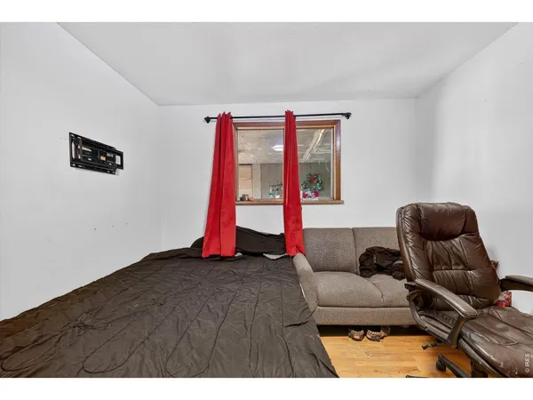 a living room with furniture and a ceiling fan