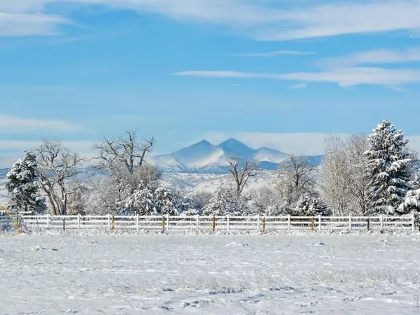 a view of a patio with table and chairs
