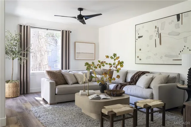 a view of a kitchen from a sink and a mirror