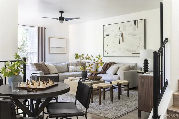 a bedroom with a bed and a potted plant