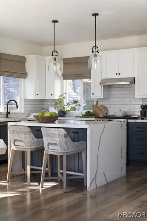 a view of a dining room with furniture and window