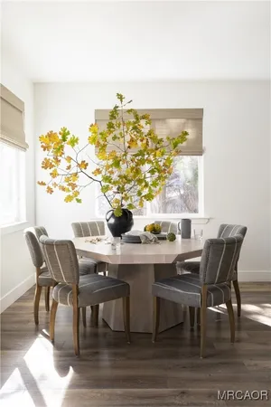 a bathroom with a sink a toilet a mirror and shower