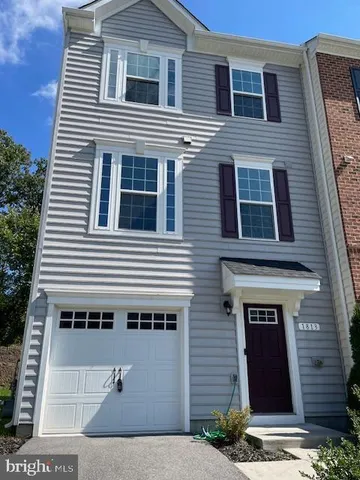a front view of a house with a garage