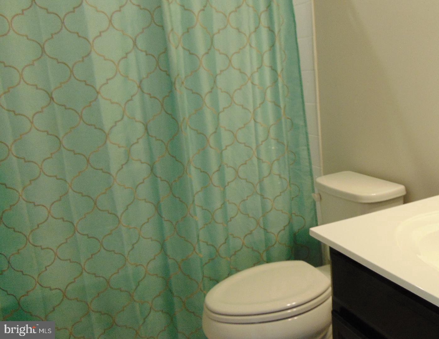 1813 Wind Gate Road Baltimore, MD 21227 - Photo 19 of 40 a white toilet sitting next to a white wall