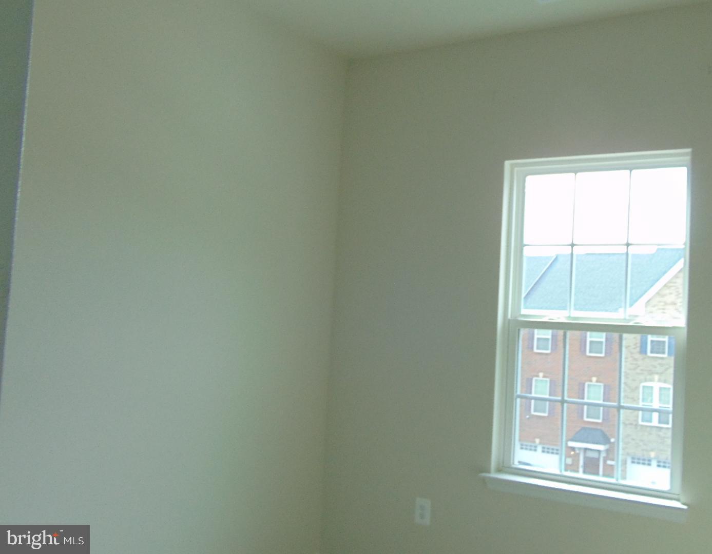 1813 Wind Gate Road Baltimore, MD 21227 - Photo 19 of 44 an empty room with a window