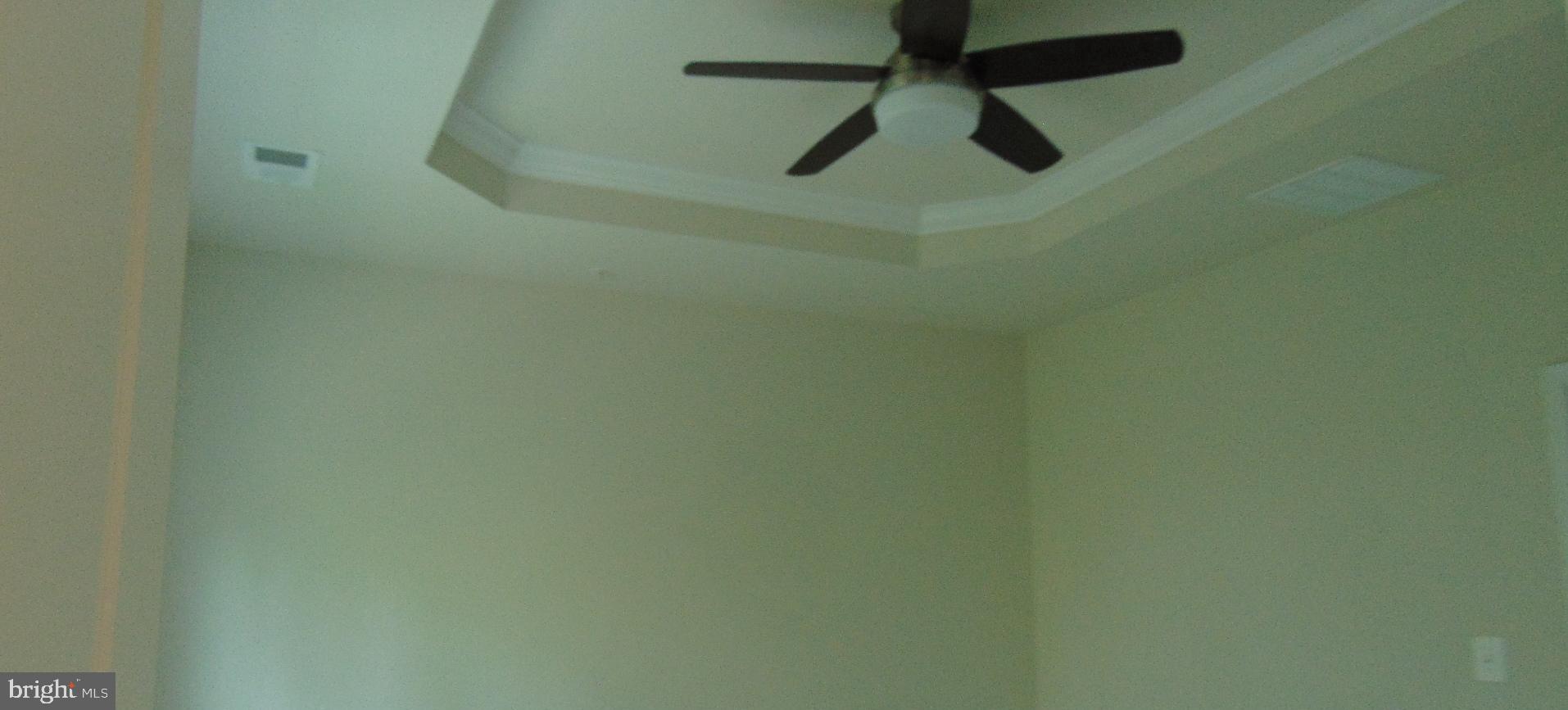 1813 Wind Gate Road Baltimore, MD 21227 - Photo 22 of 40 an empty room with a fan