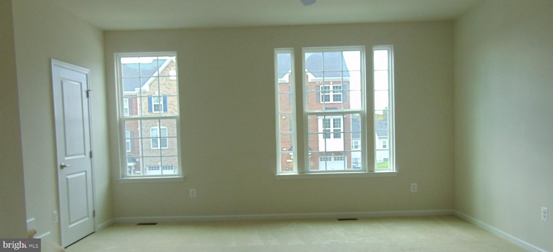 1813 Wind Gate Road Baltimore, MD 21227 - Photo 33 of 44 an empty room with windows