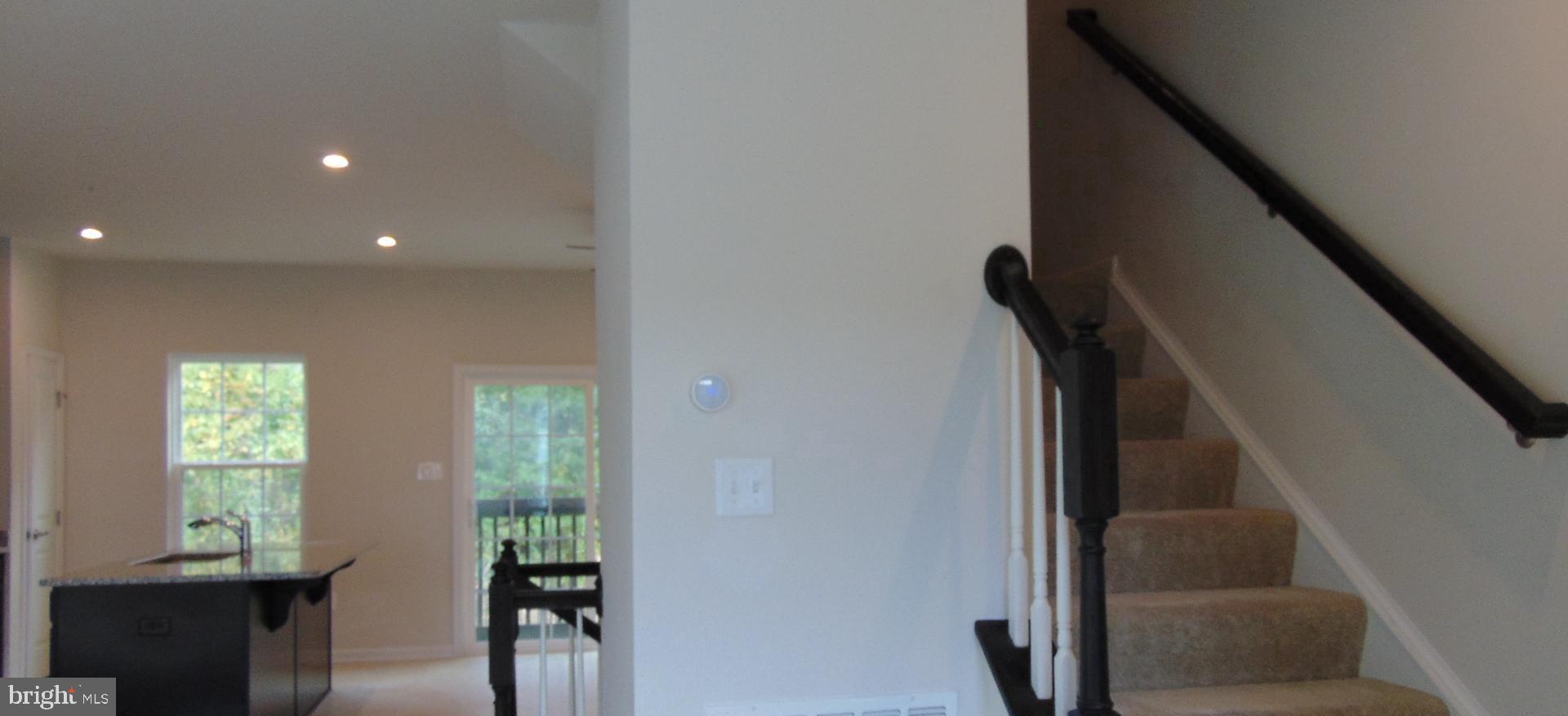 1813 Wind Gate Road Baltimore, MD 21227 - Photo 35 of 40 a view of entryway with workspace and windows