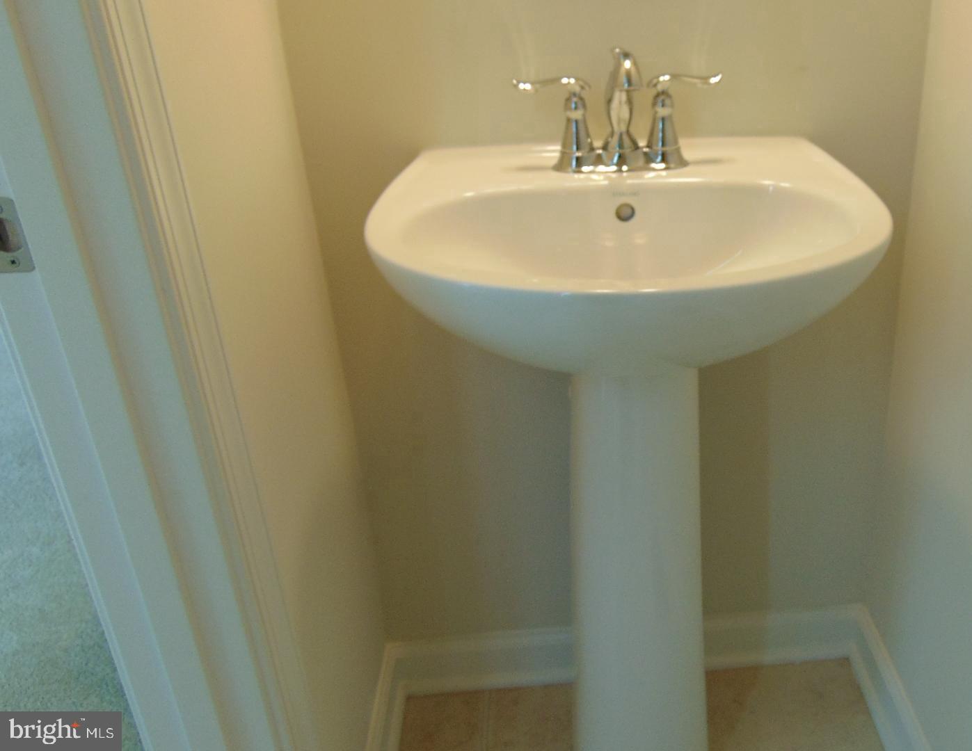 1813 Wind Gate Road Baltimore, MD 21227 - Photo 36 of 44 a bathroom with a sink