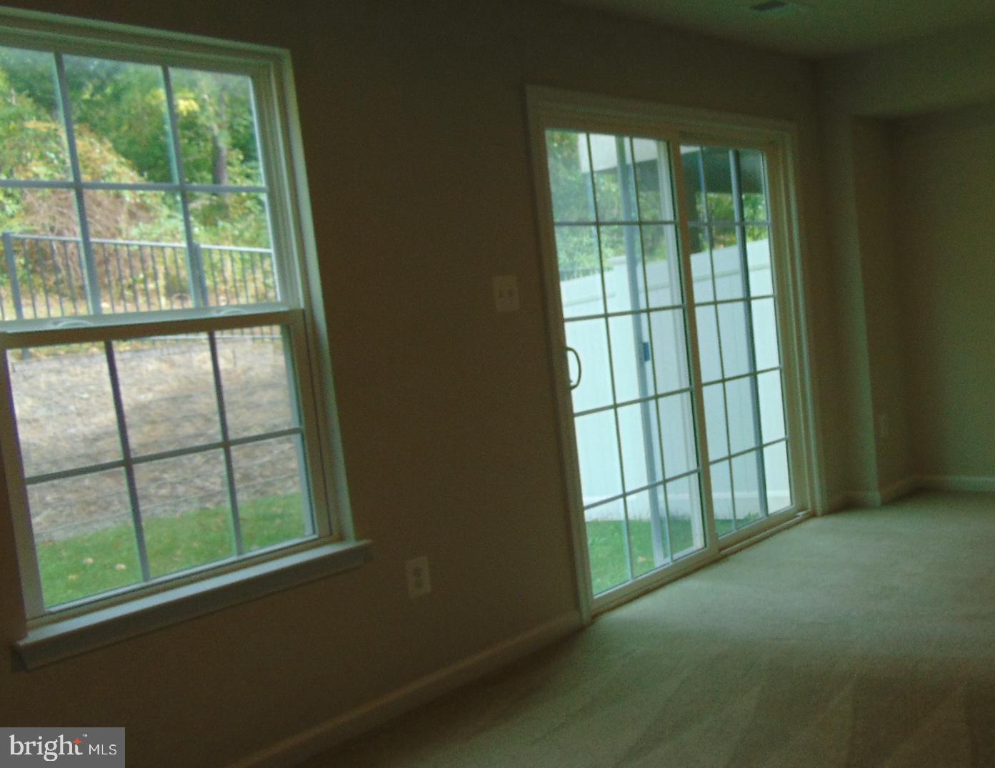 1813 Wind Gate Road Baltimore, MD 21227 - Photo 39 of 40 a view of an empty room with a window