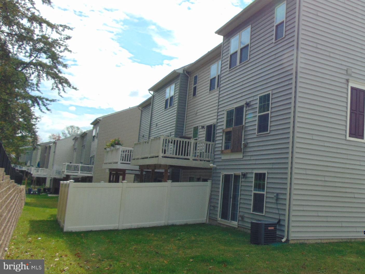 1813 Wind Gate Road Baltimore, MD 21227 - Photo 4 of 40 a view of a house with a yard