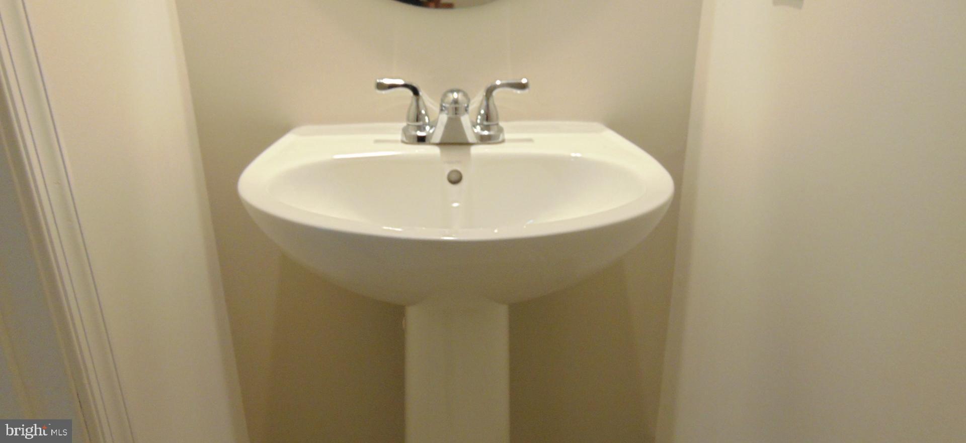 1813 Wind Gate Road Baltimore, MD 21227 - Photo 43 of 44 a bathroom with a sink