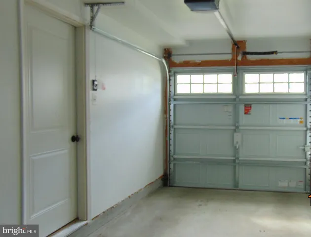a kitchen with granite countertop a refrigerator stove and microwave