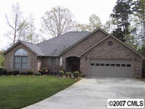 606 Keowee Lane Fort Mill, SC 29708 - Photo 1 of 8 a front view of a house with a garden and yard