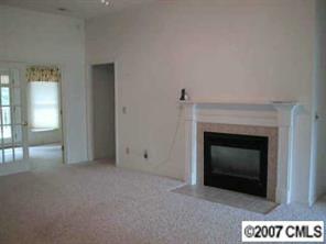 606 Keowee Lane Fort Mill, SC 29708 - Photo 4 of 8 a view of an empty room with a fireplace