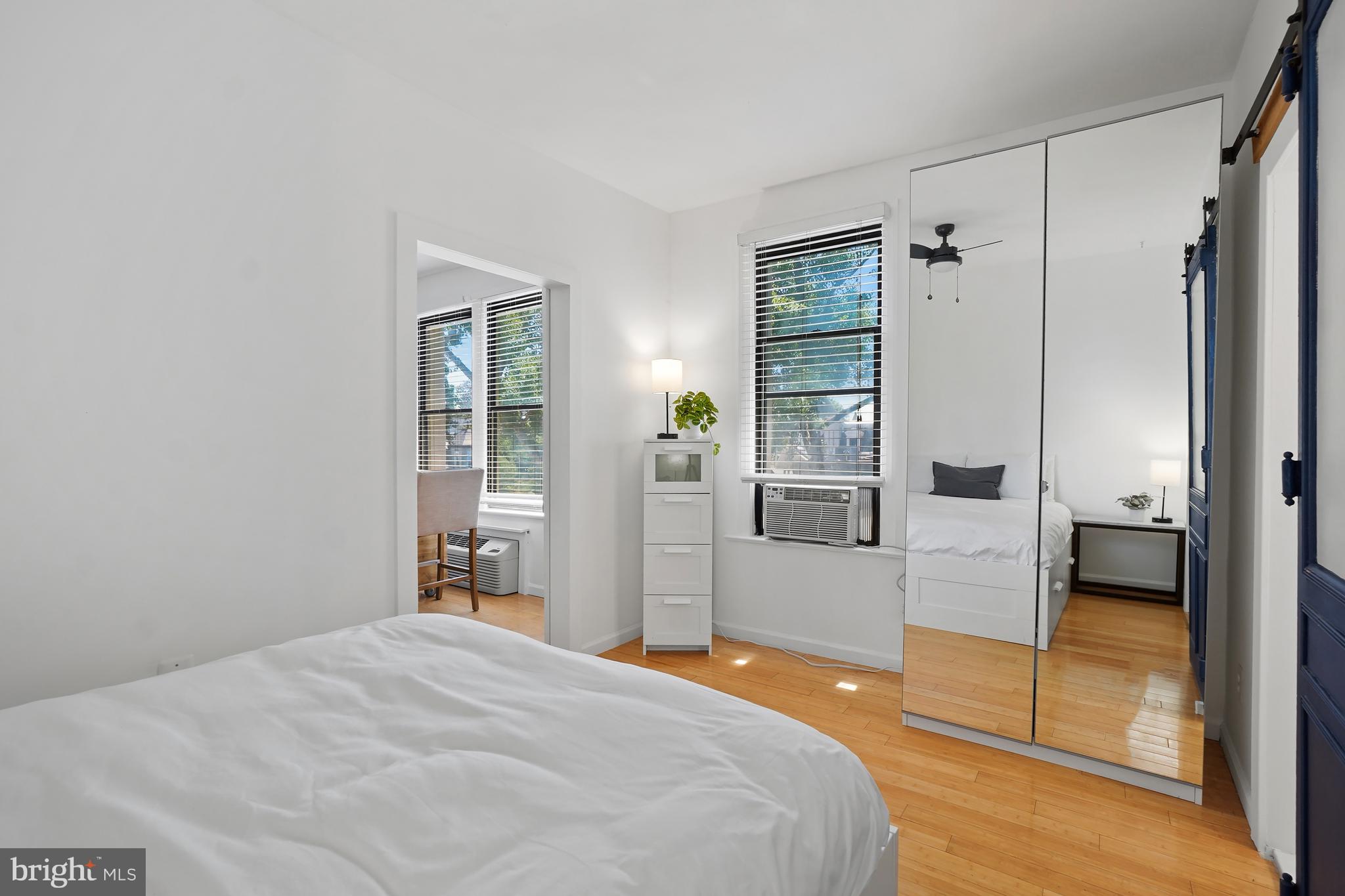 1822 15th Street Northwest, Unit 303 Washington, DC 20009 - Photo 11 of 22 a bedroom with a bed and wooden floor