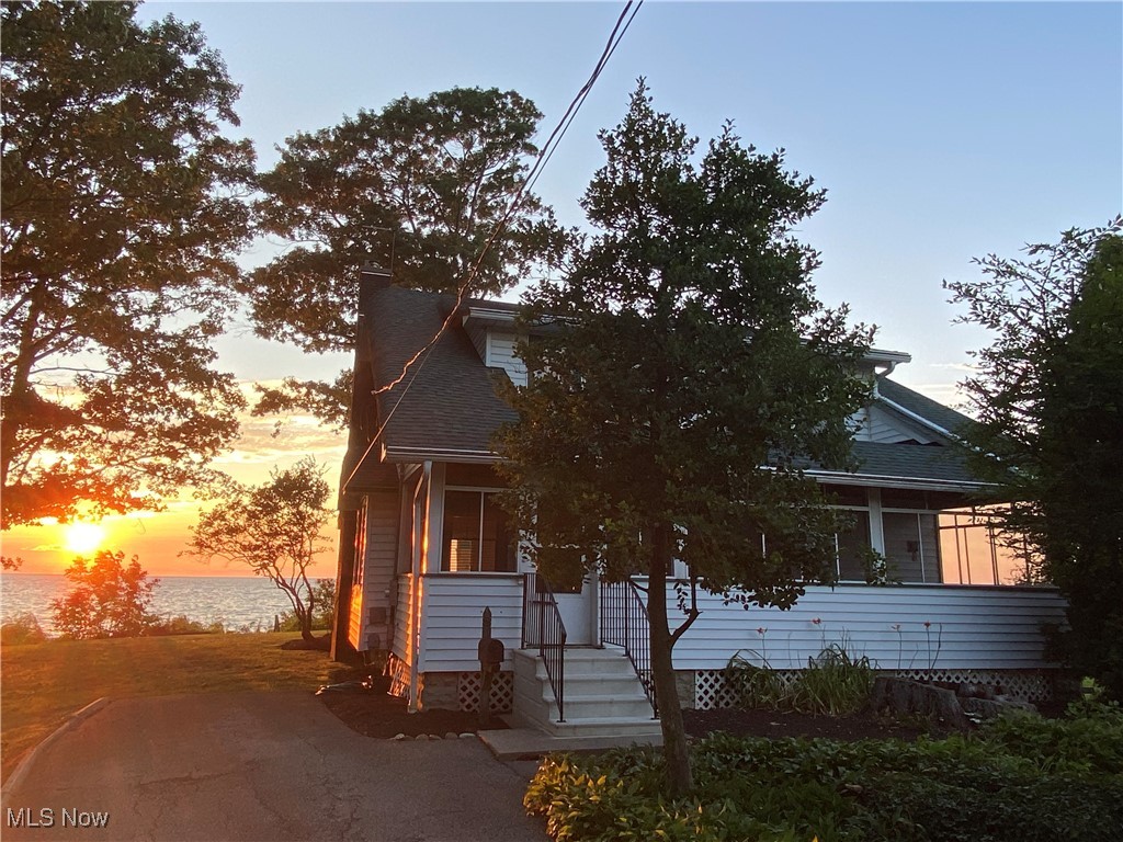 5452 Woodside Road Mentor, OH 44060 - Photo 1 of 19 View of front with sunset.
