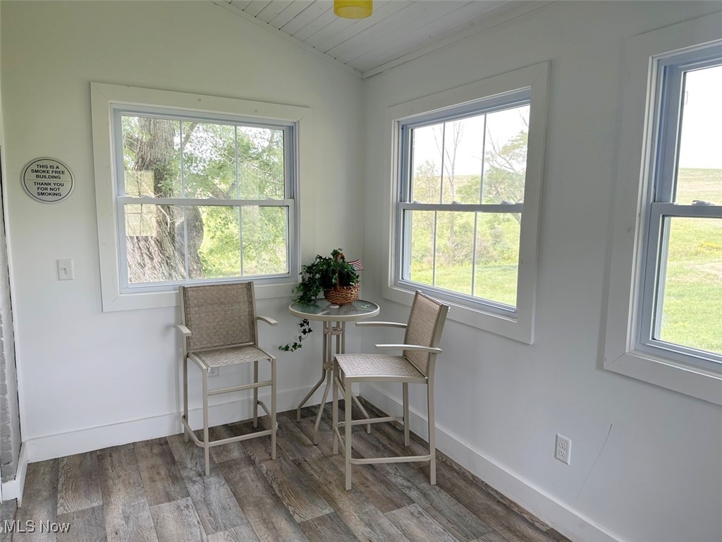 1241 Apollo Road Southeast Carrollton, OH 44615 - Photo 25 of 33 Dining room featuring wooden ceiling, lofted ceiling, and hardwood / wood-style flooring