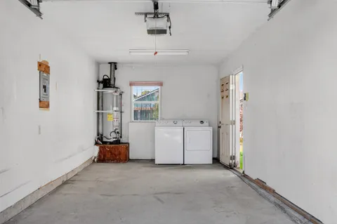 a view of a room with gym equipment and windows
