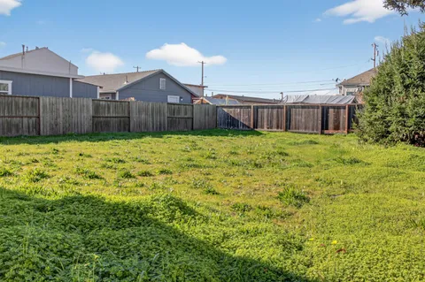 a house view with wooden fence