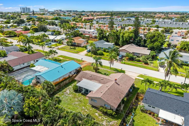 an aerial view of residential building and lake