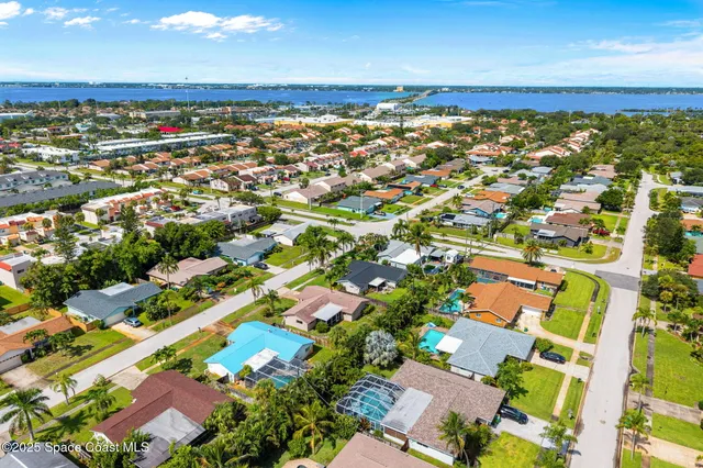 an aerial view of house with yard swimming pool and outdoor seating