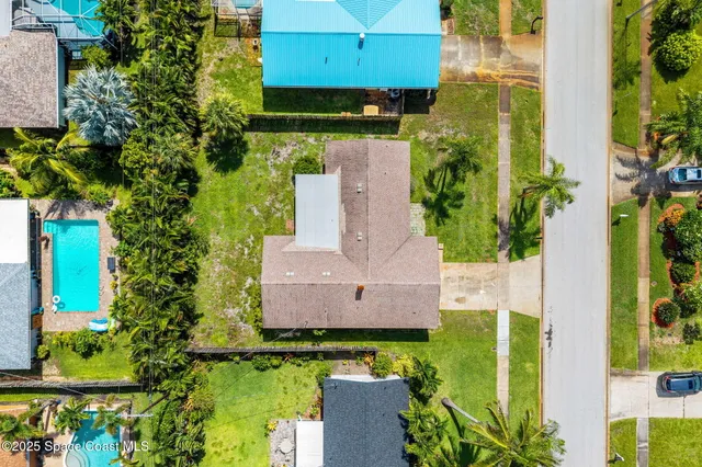 an aerial view of residential houses with outdoor space