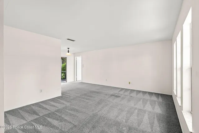 an empty room with a natural light