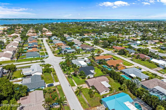 an aerial view of residential houses with outdoor space