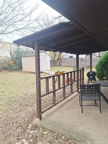 a view of a chairs and table in the patio