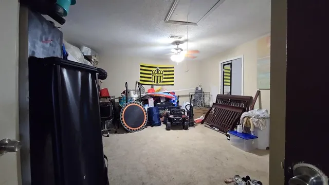 a view of a livingroom with furniture and windows