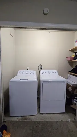 a utility room with dryer and washer