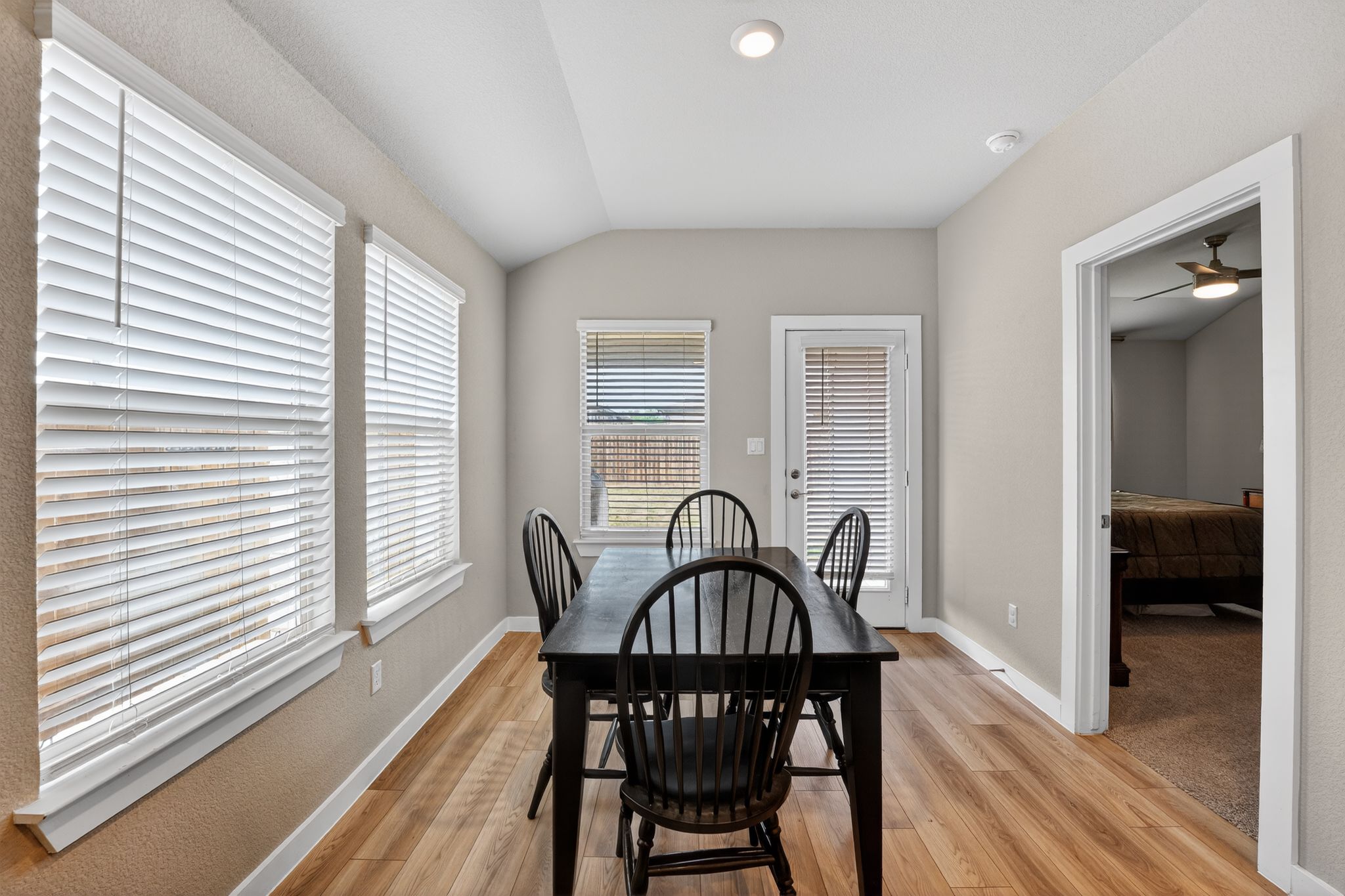 117 Halford Road Georgetown, TX 78633 - Photo 16 of 31 Dining space with vaulted ceiling, a ceiling fan, and light wood-style floors