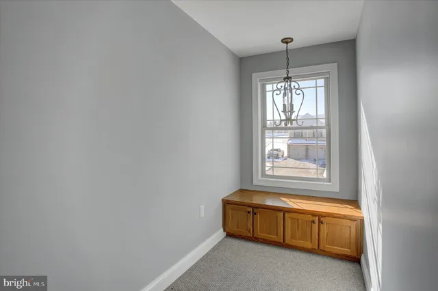 a bathroom with a granite countertop toilet a sink and mirror